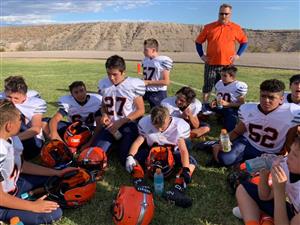 Football players are collaborating before a game